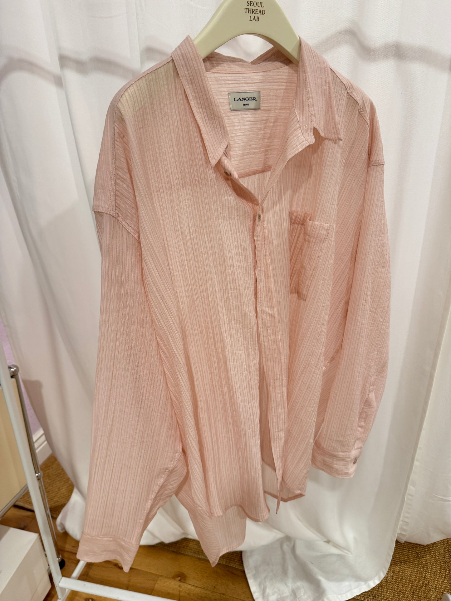 Lightly sheer pink blouse