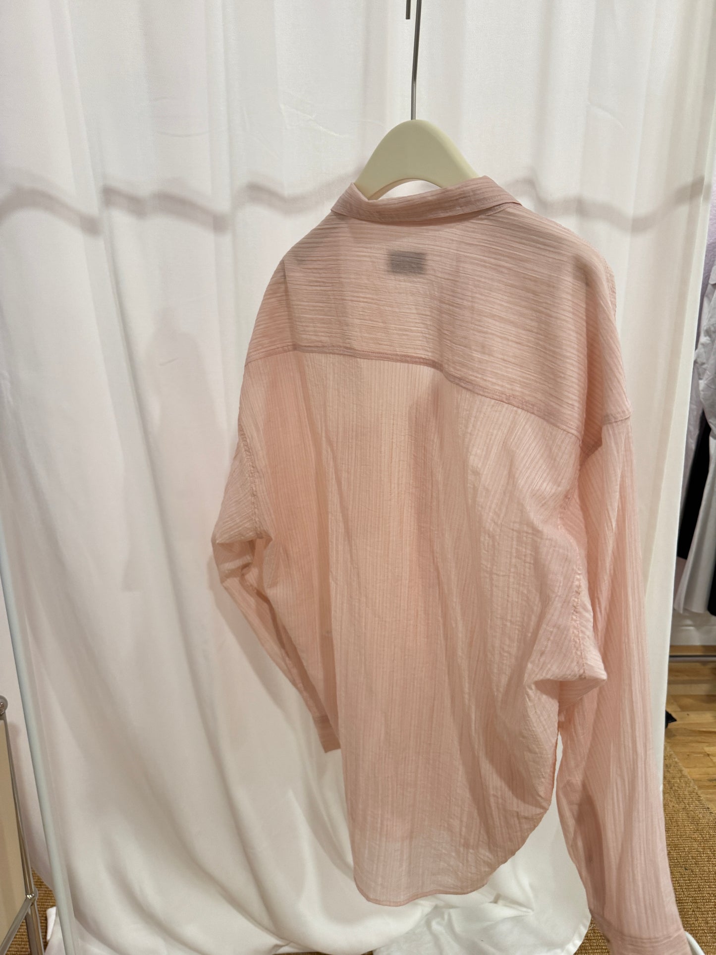 Lightly sheer pink blouse
