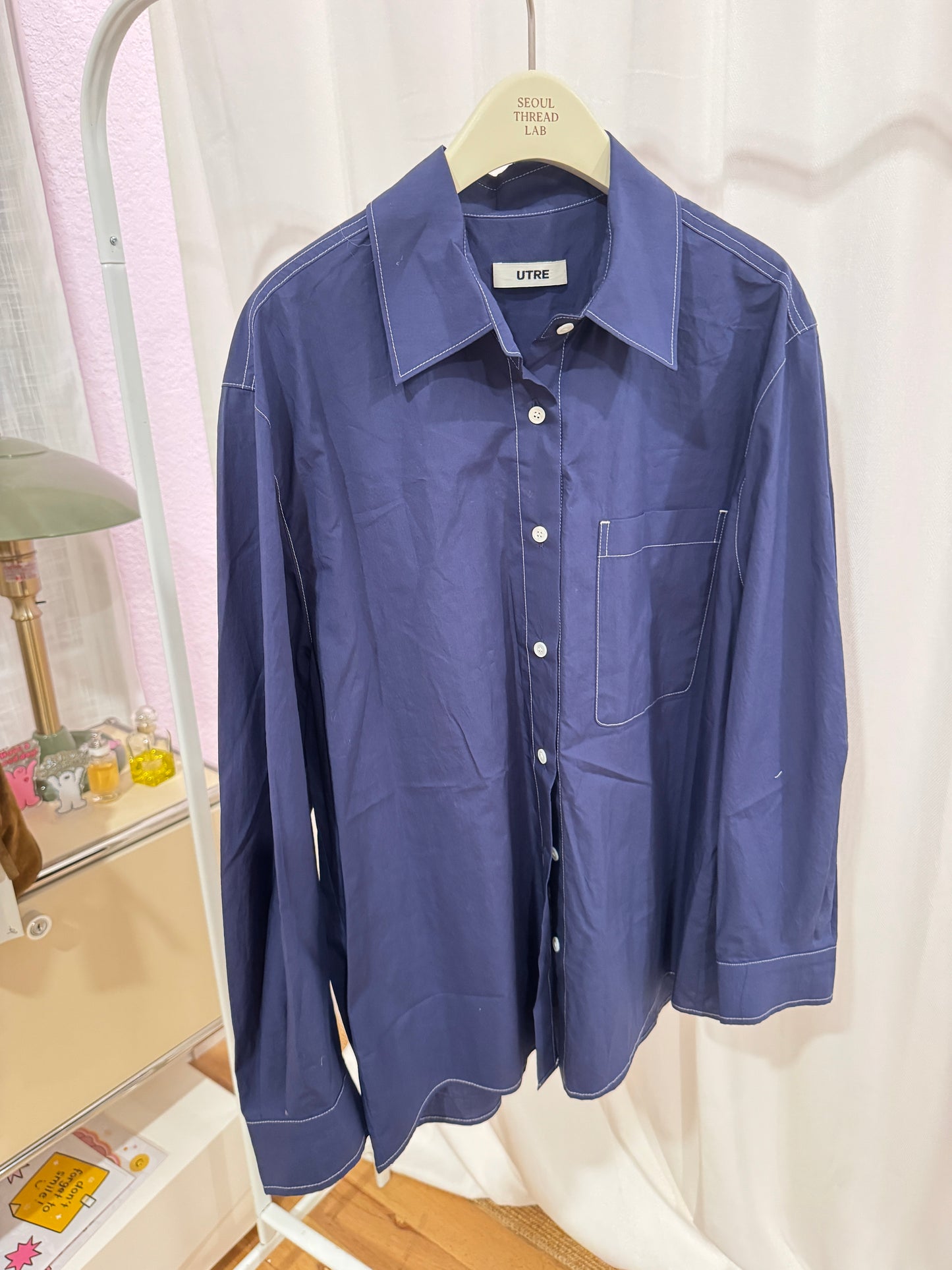 Dark blue shirt with contrast stitching