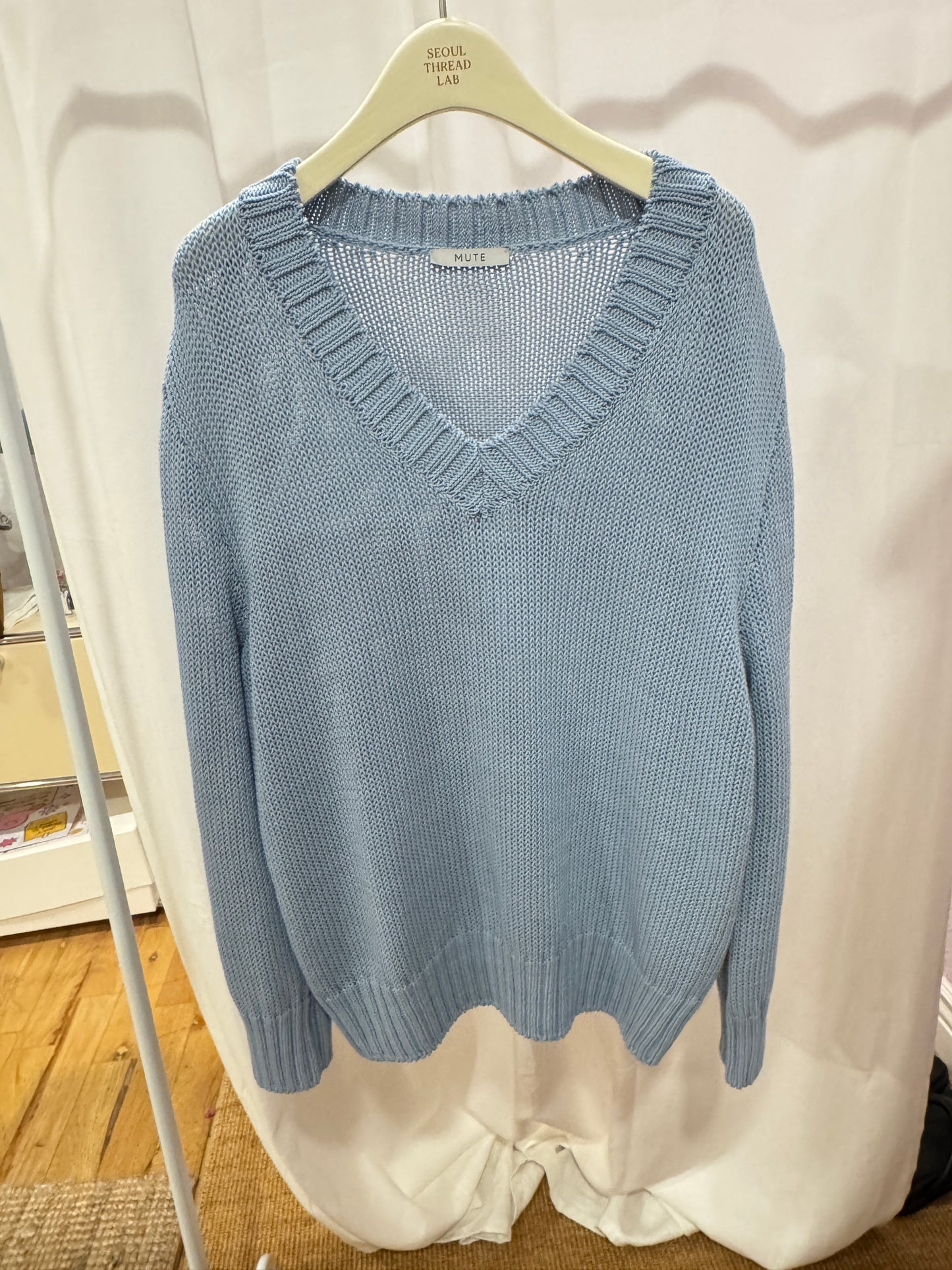 Blue V-neck knit top