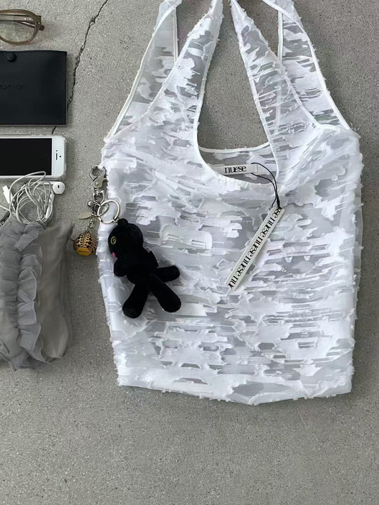 White handbag with three-dimensional flowers