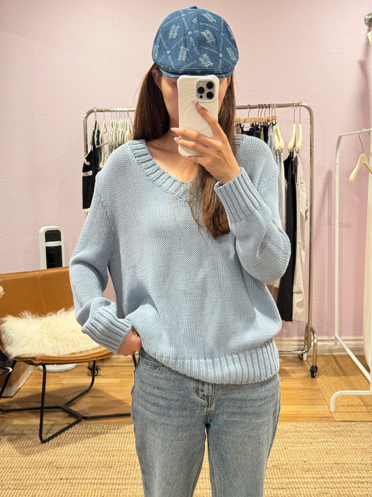 Blue V-neck knit top